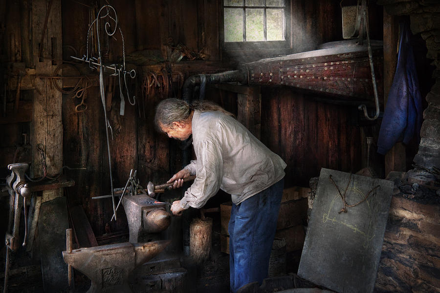 Blacksmith - Tinkering with metal  Photograph by Mike Savad