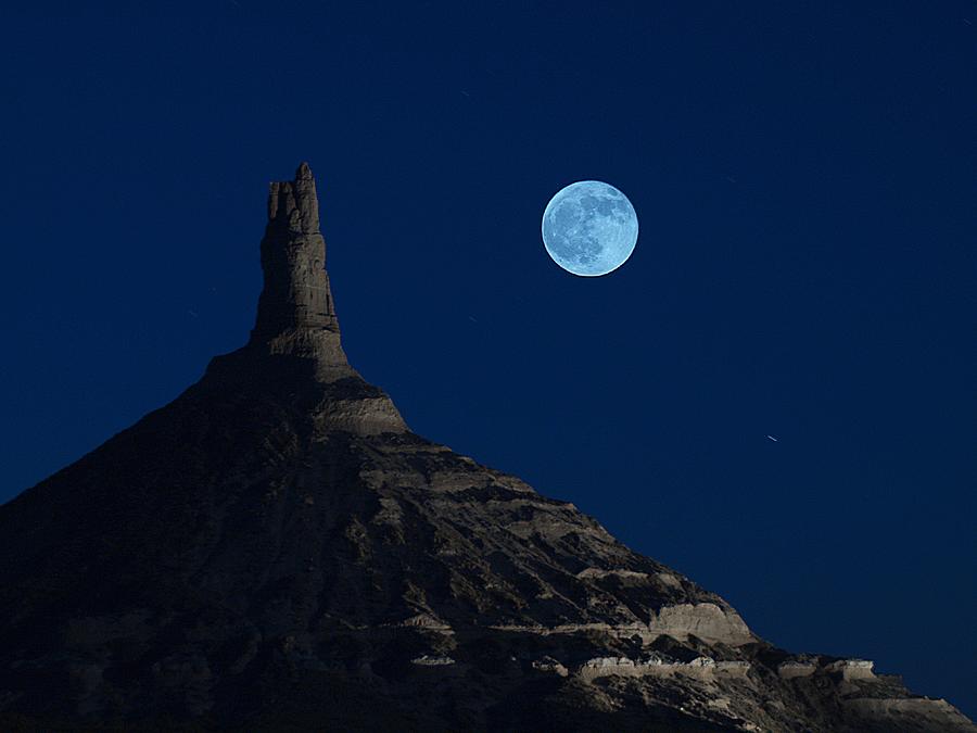 Blue moon over Chimney Rock Photograph by HW Kateley