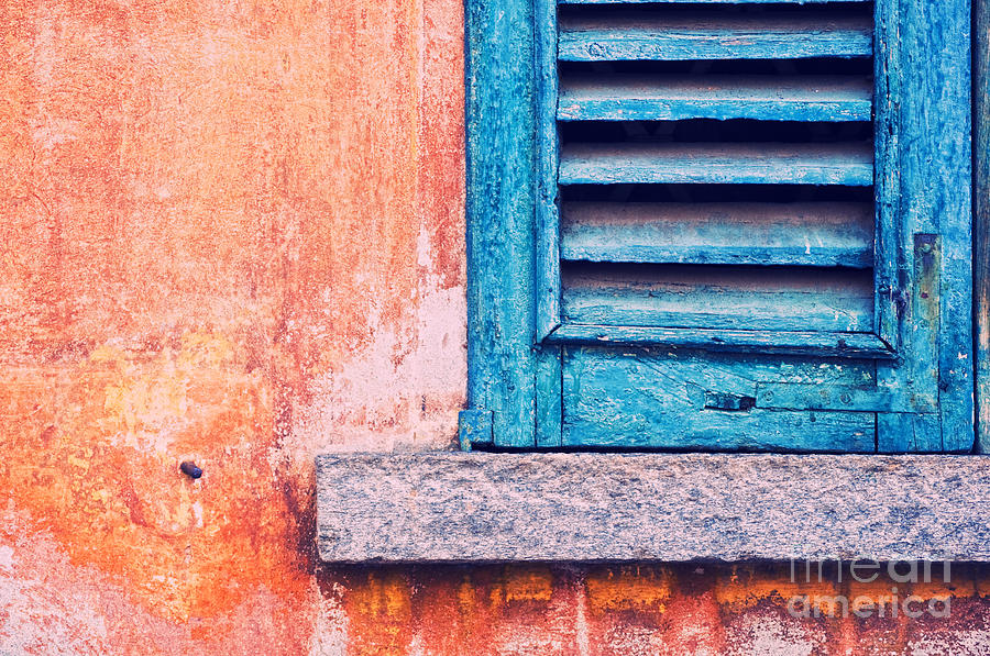 Blue shutter on orange wall Photograph by Silvia Ganora