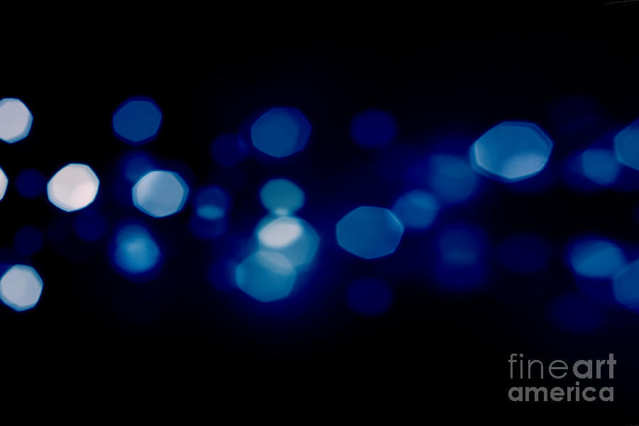 Blue starburst lights Photograph by Simon Bratt