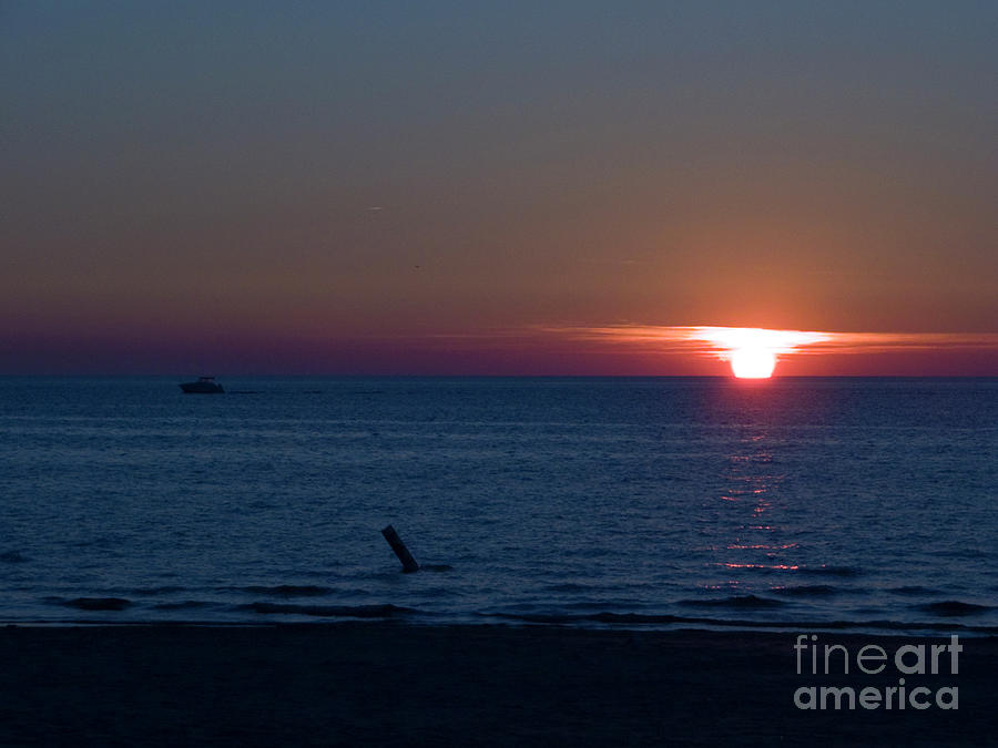 Boat and Sunset on Lake Michigan Photograph by Tim Mulina