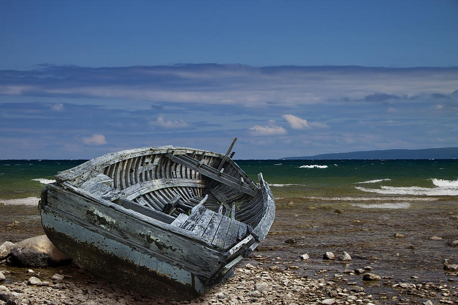 Lake Michigan Photograph - Boat lying shipwrecked on a Lake Michigan Shore by Randall Nyhof