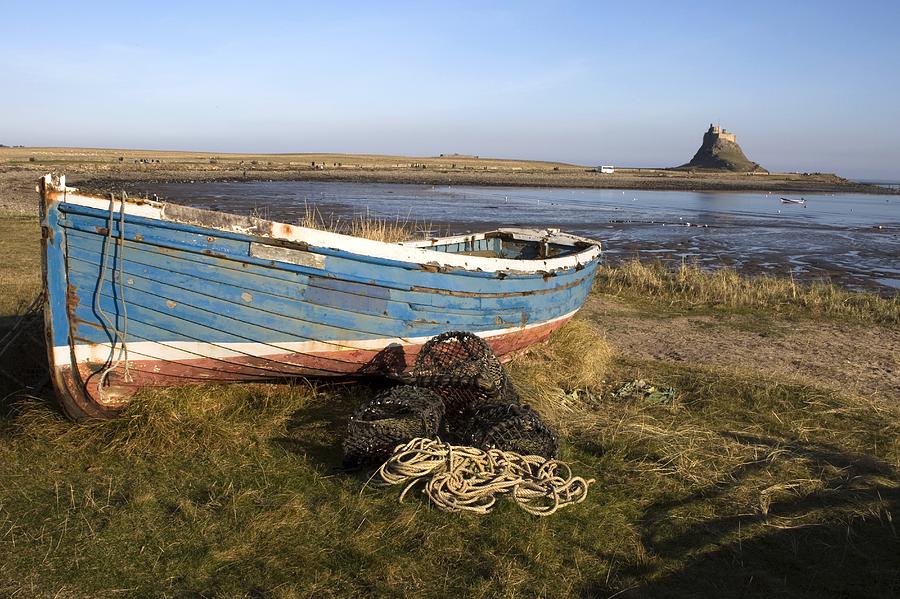 Boat On Shore, Near Holy Island, England Photograph by 