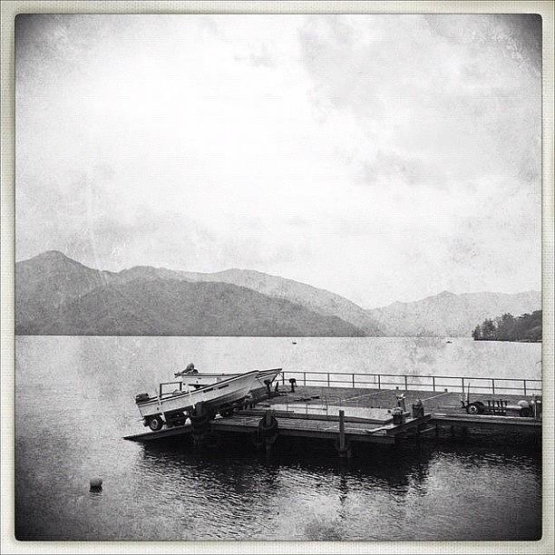 Black And White Photograph - Boat On The Lake by Marc Gascoigne