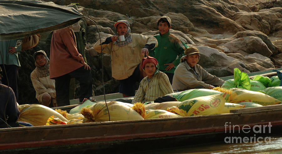 Boatmen in Laos Photograph by Bob Christopher