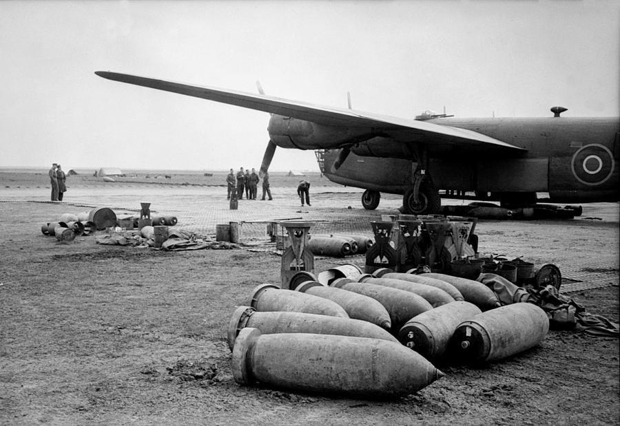 Airplane Photograph - Bombs Lie On An Allied Airfield Ready by Everett