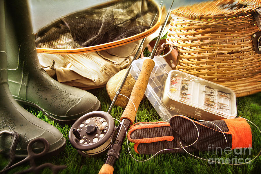 Boots and fly fishing equipment on grass Photograph by Sandra Cunningham