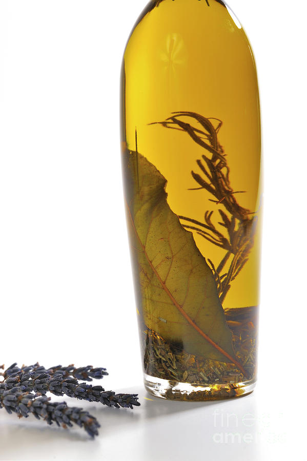 Bottle Photograph - Bottle of herb-infused olive oil and lavender by Sami Sarkis