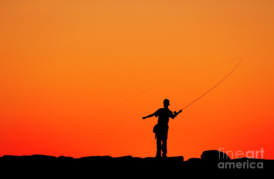 Boy Fishing From A Jetty Photograph