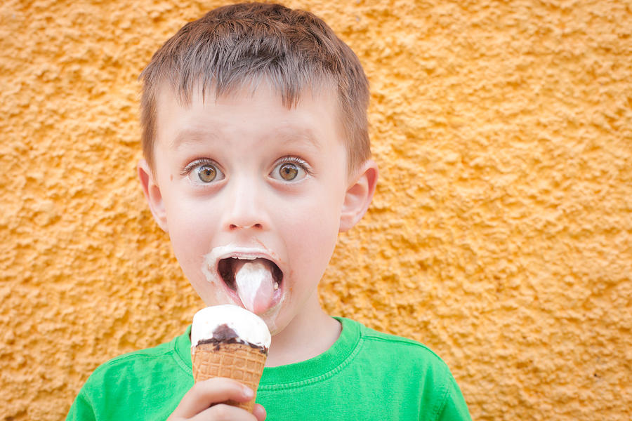 Ice Cream Photograph - Boy having ice cream by Tom Gowanlock