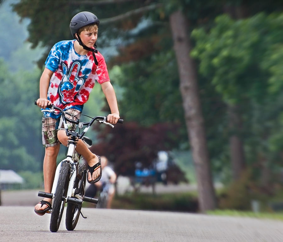 Sports Photograph - Boy on a Bike by Susan Leggett