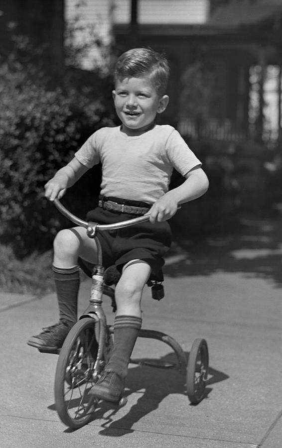 boy on tricycle