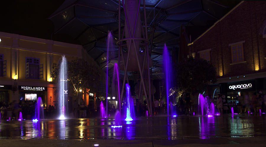 Brightly colored fountains at Clarke Quay in Singapore Photograph by Ashish Agarwal
