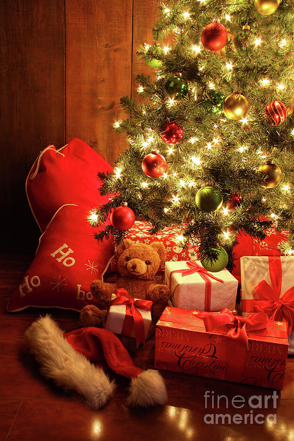 Christmas Photograph - Brightly lit Christmas tree with gifts by Sandra Cunningham