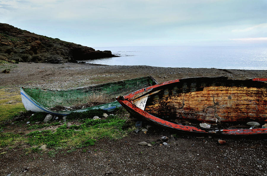 Broken boats Photograph by Perry Van Munster