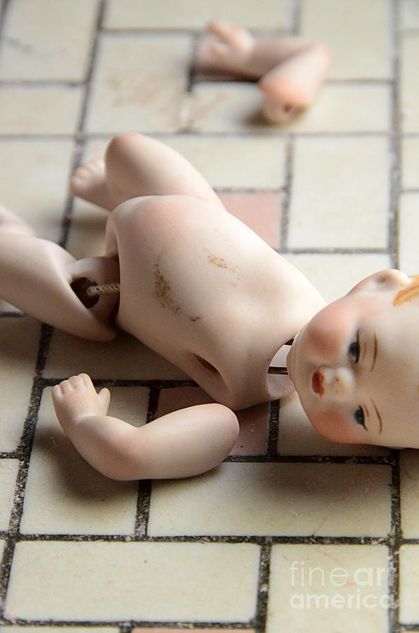 Broken Doll on Tile Floor Photograph by Jill Battaglia