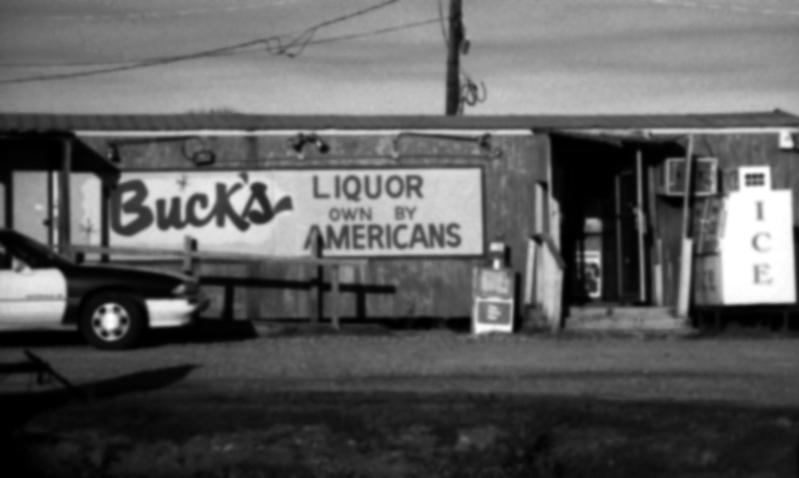 Dorothea Lange Photograph - Bucks Liquor Own By Americans by Doug Duffey