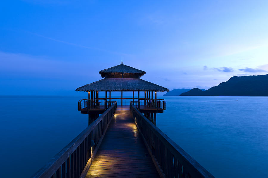 Building at the end of a jetty during twilight Photograph by U Schade