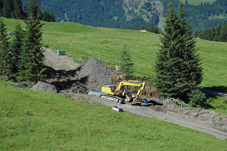 Tree Photograph - Bulldozing a new path on a Swiss mountain side by Ashish Agarwal