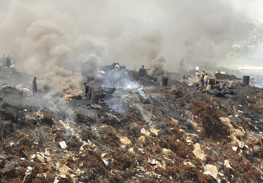 Burning Rubbish, Nigeria Photograph by Johnny Greig