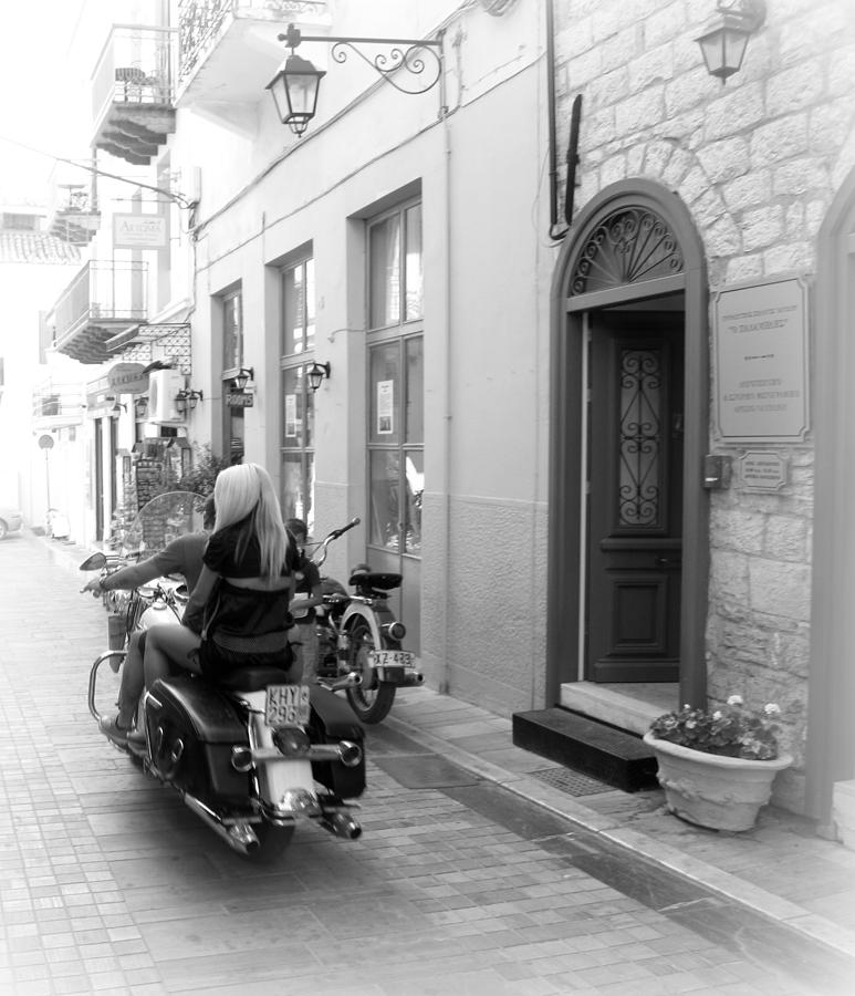 BW Girl Riding Glowing Motorcycle Bike Rider Speed Stone Paved Street in Nafplion Greece Oval  Photograph by John Shiron