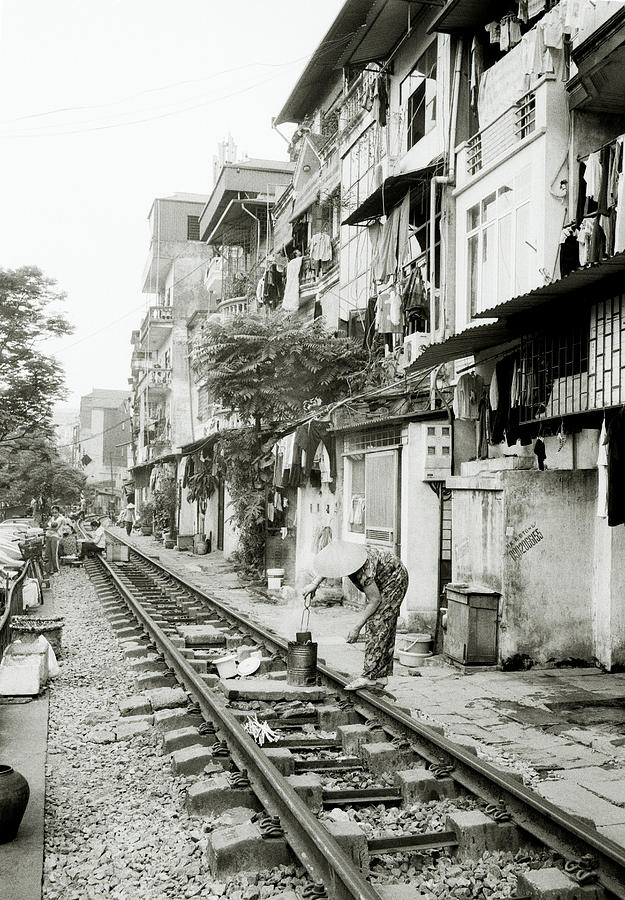 By The Tracks In Hanoi Photograph by Shaun Higson