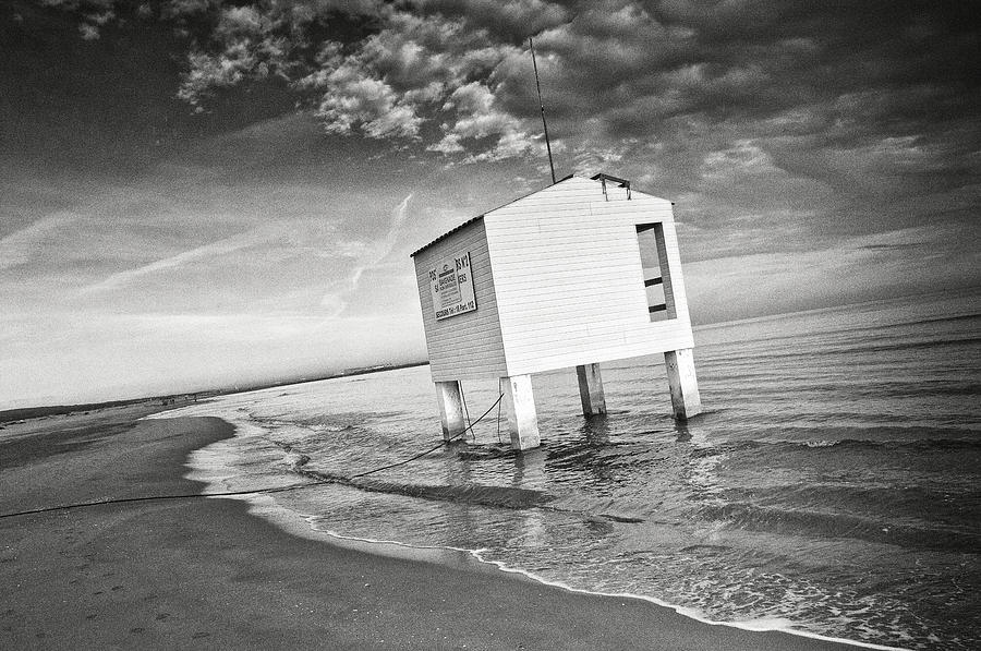 Cabin on the shore Photograph by Philippe Taka