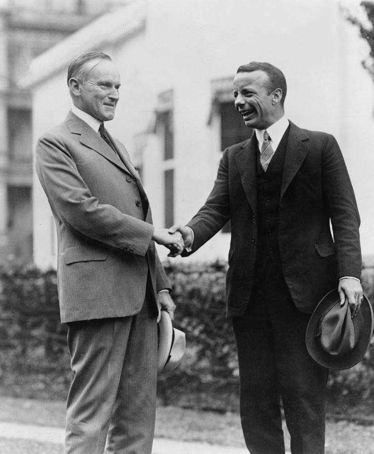 Calvin Coolidge shakes hands with Theodore Roosevelt Jr - c 1924 Photograph by International  Images