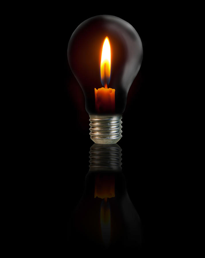 Candle On Light Bulb On Black Background Photograph by ...