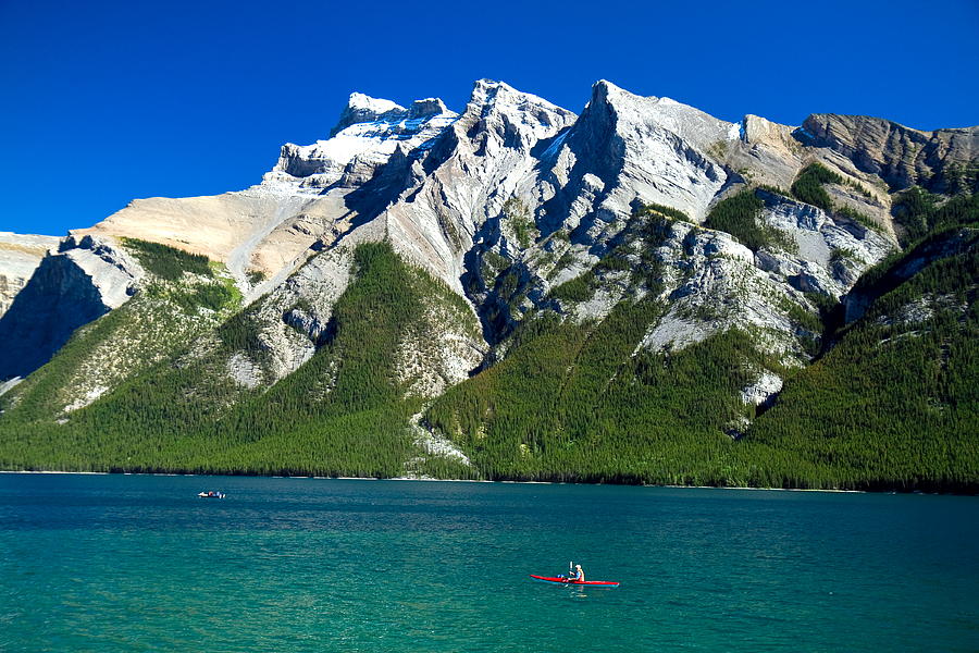 Banff National Park Photograph - Canoeing in Lake Minnewanka by Eric Epie