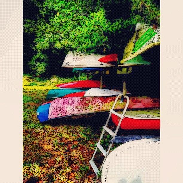 Boat Photograph - Canoes By The Riverside by Kim Cafri