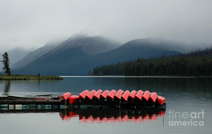 Canoes on Maligne Lake Photograph by Vivian Christopher