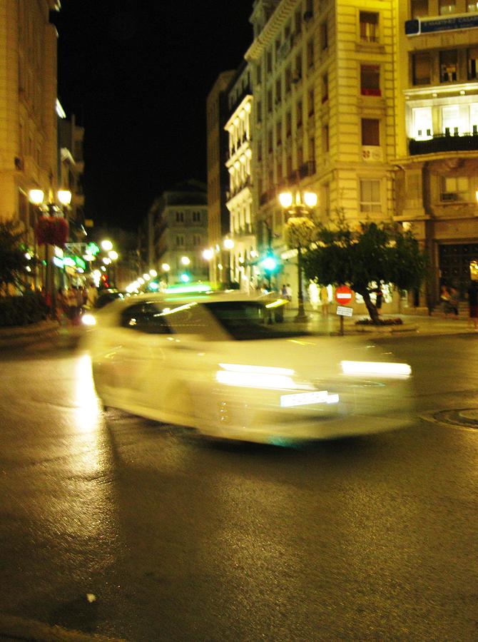Car Speeding Thru the Streets of Granada Spain at Night Photograph by John Shiron