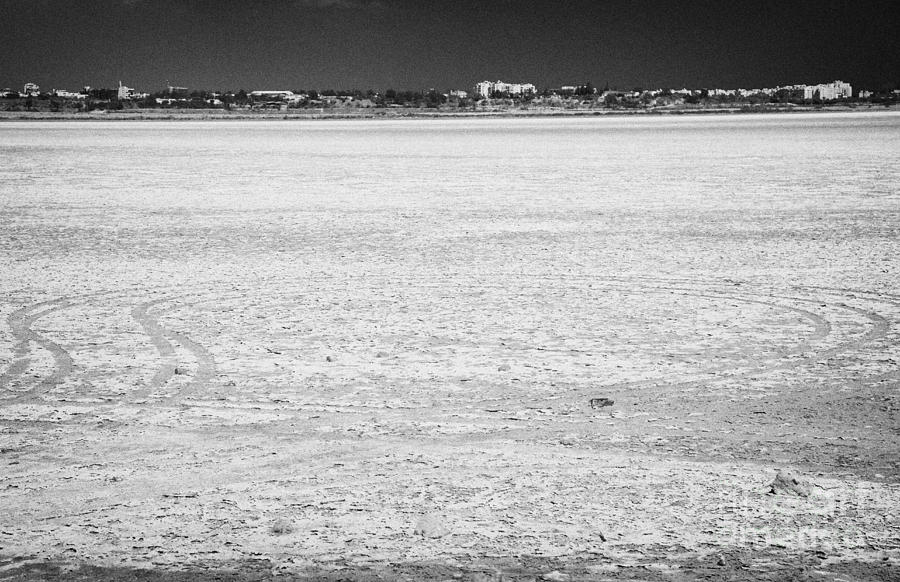 Summer Photograph - Car Tracks On Larnaca Salt Flats In The Larnaka Salt Lake Republic Of Cyprus Europe by Joe Fox