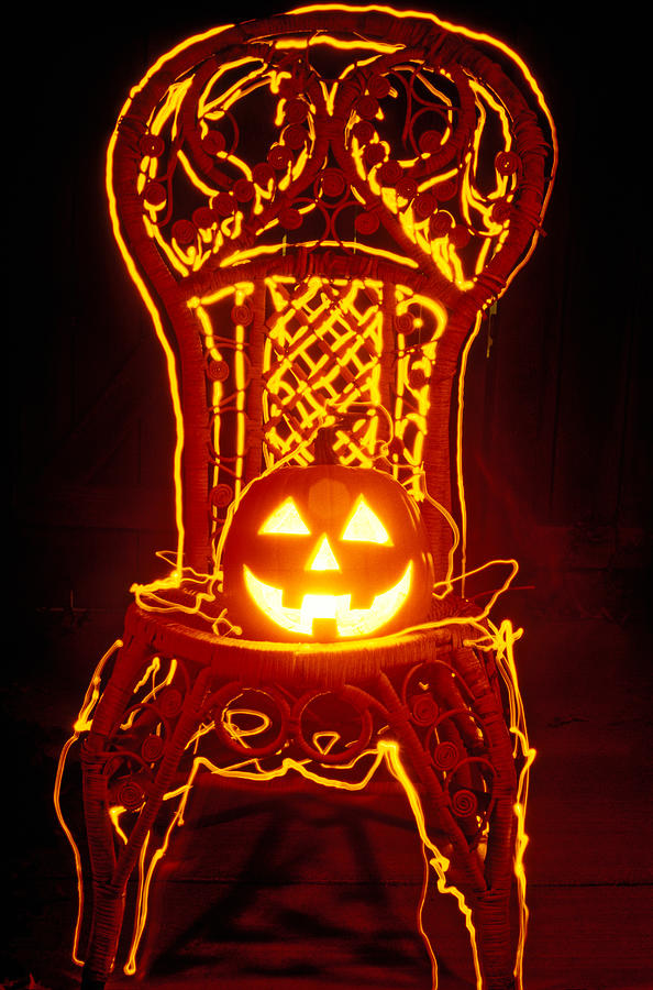 Pumpkin Photograph - Carved smiling pumpkin on chair by Garry Gay