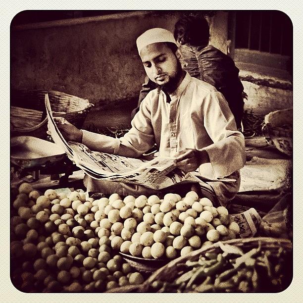 India Photograph - Catching Up On The News. Vegetable by Jonathan Tyrrell 