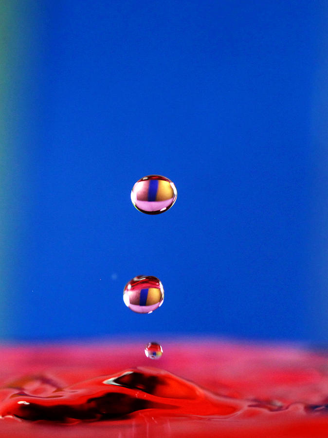 Cats eye Water drops Photograph by Paul Ge