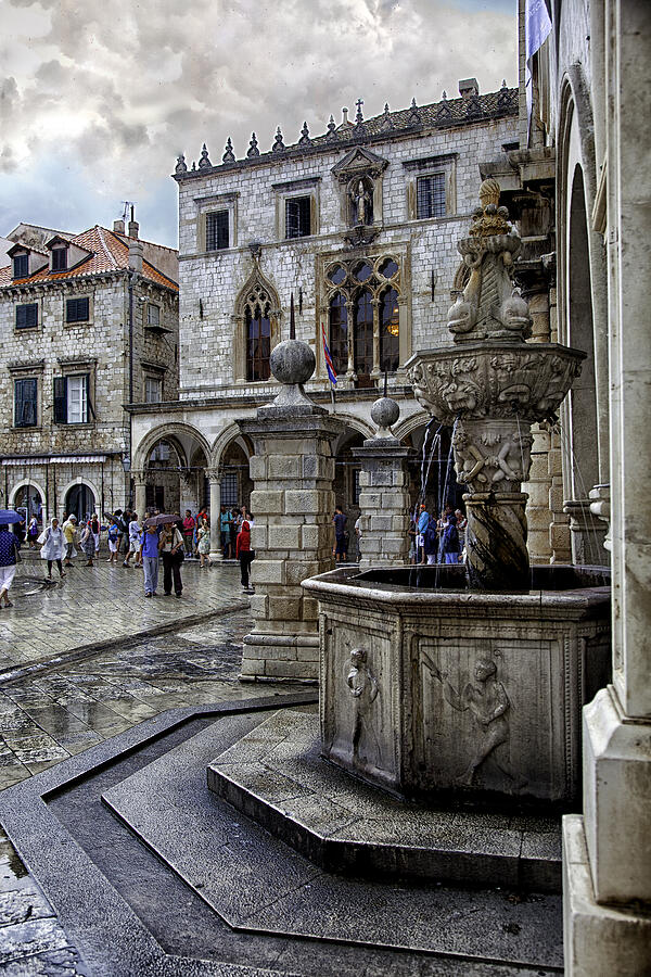 Caught in the Rain - Dubrovnik Photograph by Madeline Ellis