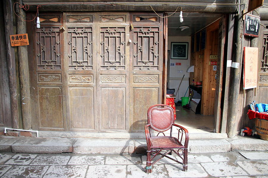 Chair and Wooden Door Photograph by Valentino Visentini