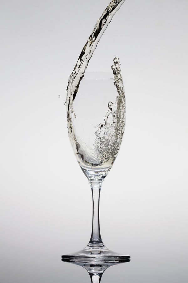 Champagne Being Poured Into A Glass Photograph by Dual Dual