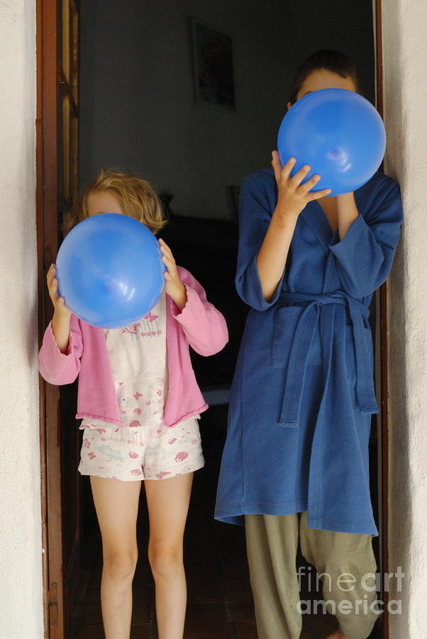 Children blowing up balloons Photograph by Sami Sarkis