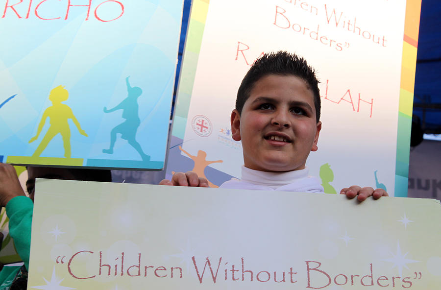 Christmas Photograph - Children Without Borders by Munir Alawi