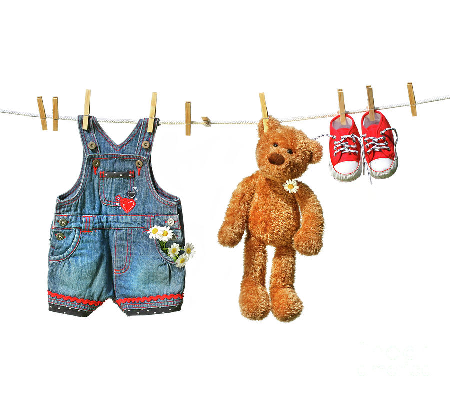 Childrens clothes with teddy bear on clothesline Photograph by Sandra Cunningham