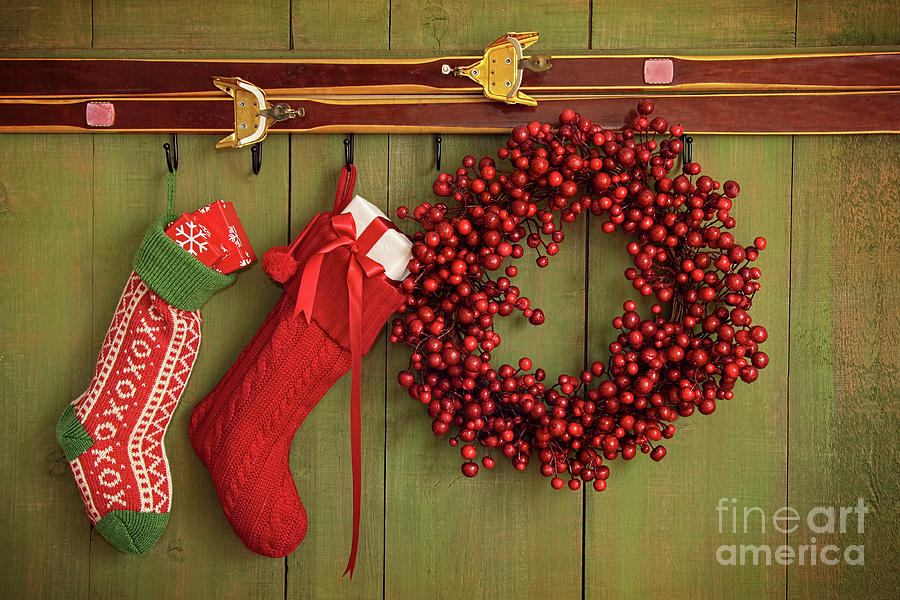 Christmas stockings and wreath hanging on  wall Photograph by Sandra Cunningham