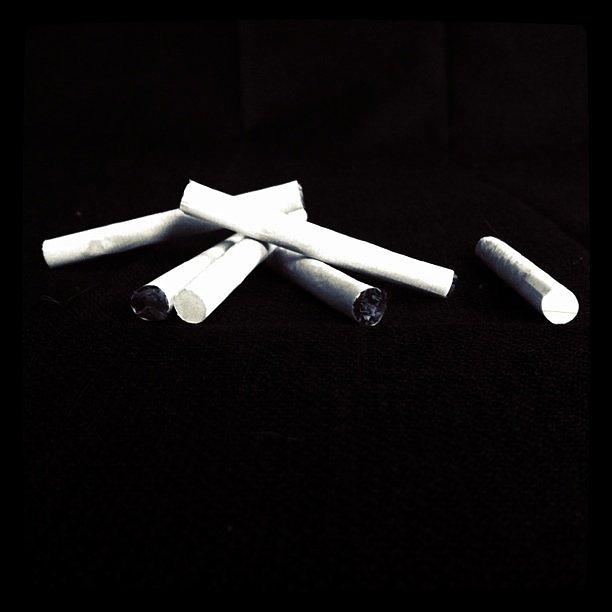 Black And White Photograph - Cigarettes by Cassie OToole