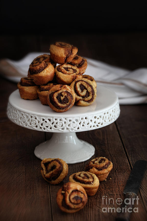 Bread Photograph - Cinnamon pinwheel rolls on cake stand by Sandra Cunningham