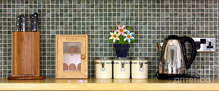 Clean kitchen worktop with kitchen items Photograph by Simon Bratt