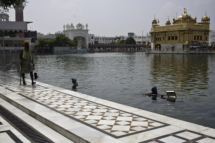 Clearing the sarovar inside the Golden temple resorvoir Photograph by Ashish Agarwal