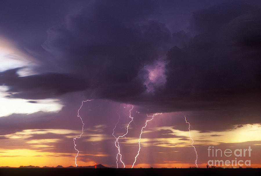 Cloud to Ground Lightning at Sunset Photograph by John A Ey III and Photo Researchers