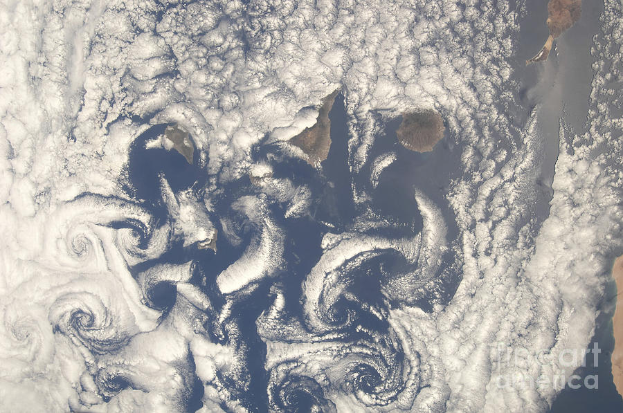 Space Photograph - Cloud Vortices In The Area by Stocktrek Images
